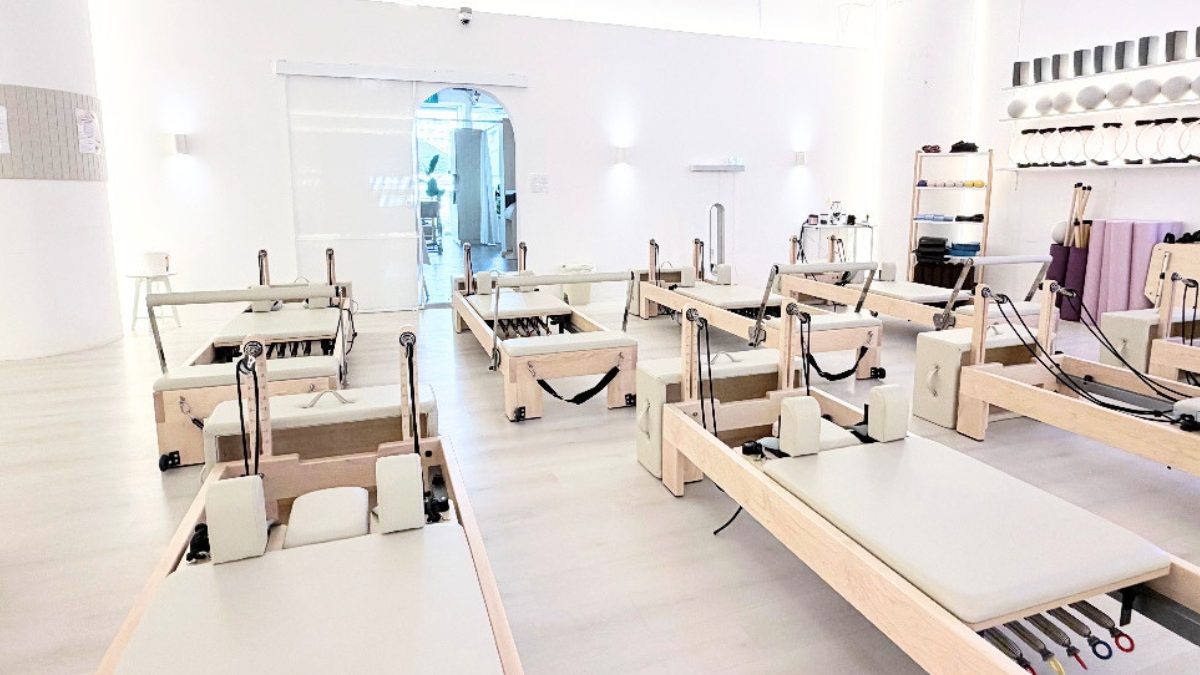 Reformers by the window at the Line Pilates studio on Orchard Road